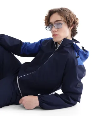 Rare Rabbit Men Wando Dark Blue Polyester Fabric Full Sleeve Hooded Zipper Closure Colorblock Jacket